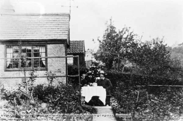 Mr and Mrs G Bell take tea at their summer house, Hungerhill Gardens, St Ann's, c 1860's , Nottinham City Council