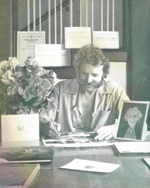 Harry in his office, witha photo of his mother, from My LIfe with Roses